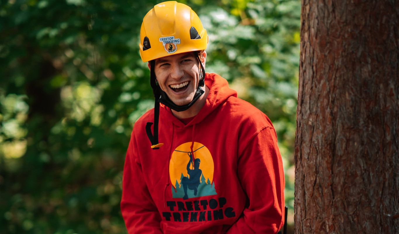 Smiling guide Treetop Trekking