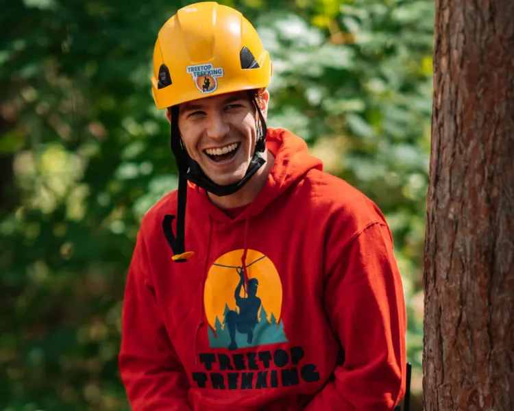 Smiling guide Treetop Trekking